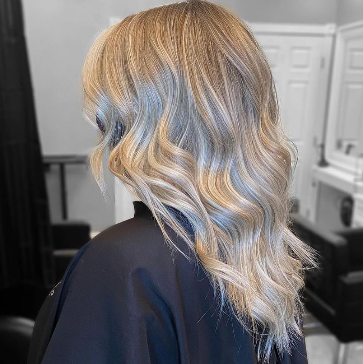Blended warm and cool blonde styled in soft waves at Plush Salon & Spa, Oakdale PA