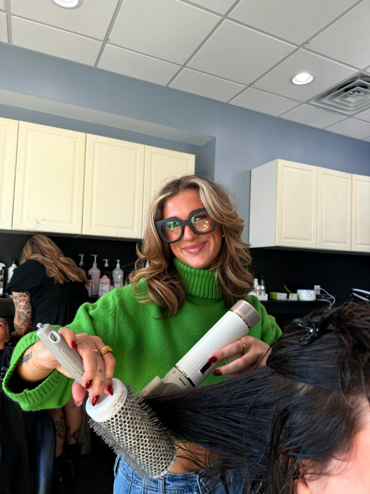 Stylist Desi blow drying a client with a round brush at Plush Salon & Spa, Oakdale PA