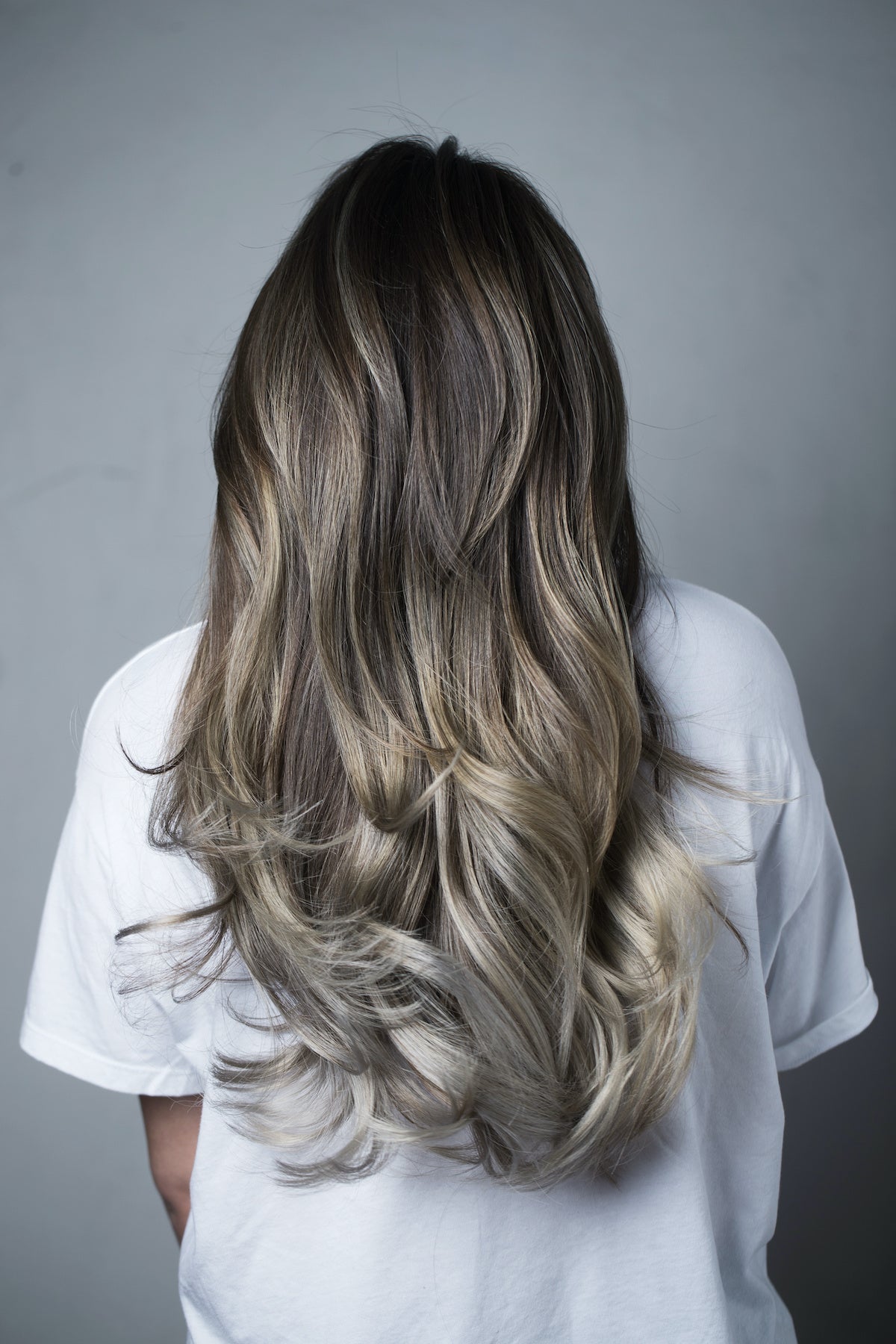 Dimensional ash blonde balayage on long layered hair at Plush Salon & Spa, Oakdale PA